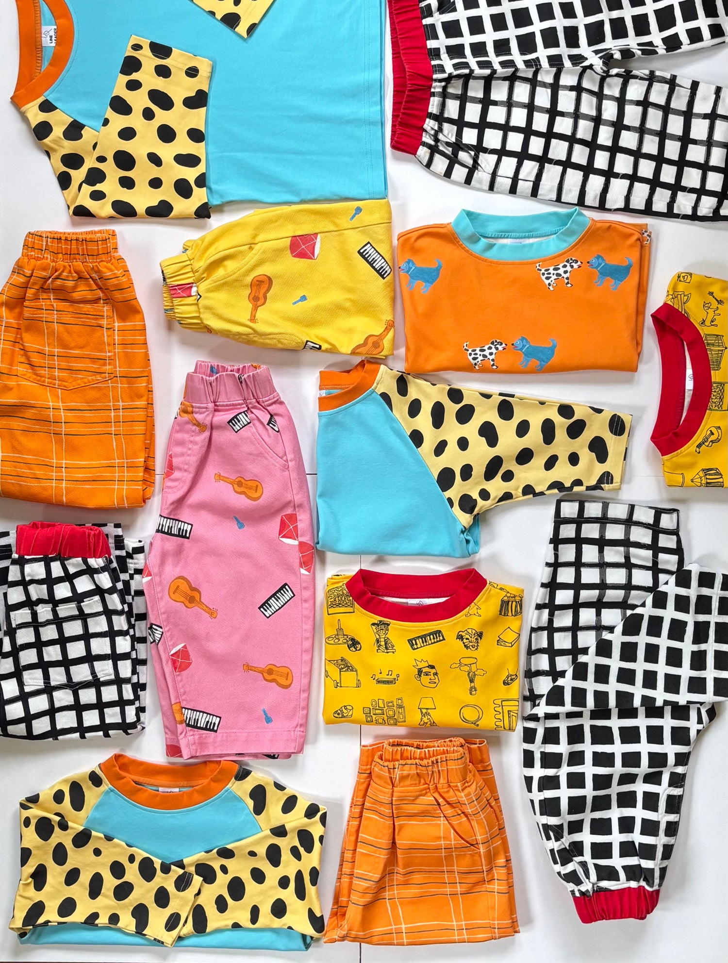 Colorful kid, clothing, featuring hand, painted prints ￼
