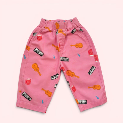 Kids Pink pants with musical instrument pattern made of cotton twill