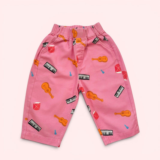 Kids Pink pants with musical instrument pattern made of cotton twill